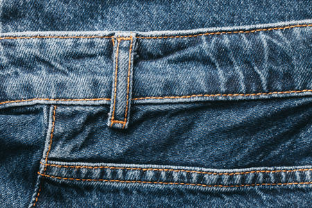 Jeans blue denim with brown thread sew pattern.