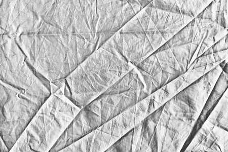 Gray wrinkled and crumpled lines fabric background.の写真素材