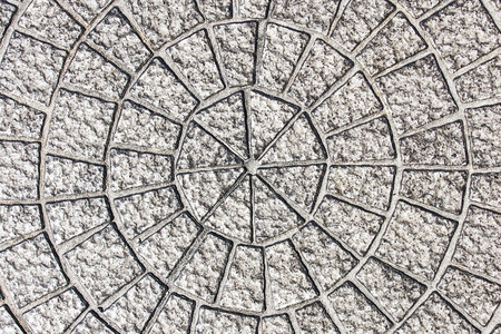 Circle shape pavement stones. Gray street cobblestone blocks texture.