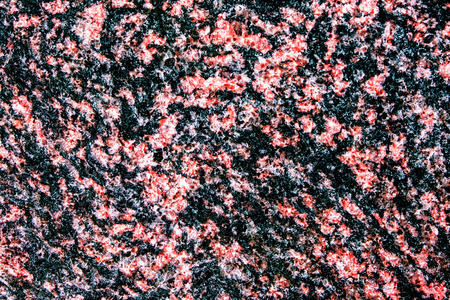 Red grain noisy mineral marble pattern background.の写真素材
