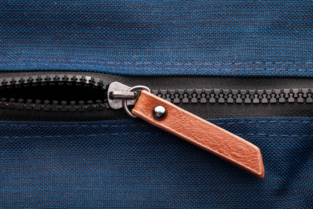 Hand bag black plastic zipper. Fashion fabric material texture.