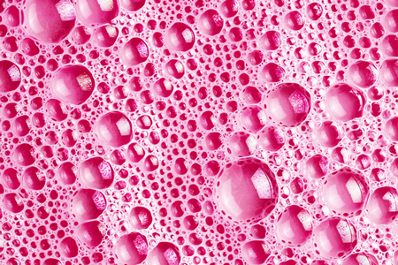 Pink foam bubble texture. Abstract water washing suds pattern background.の写真素材