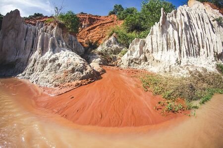 Mui Ne in Vietnam. Red sand scenic canyon wide angle. Walking in low water level river.の写真素材