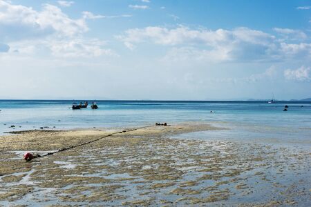 Ko Phi Phi island outflow. Vacations in Thailand scenic view. Low water level wet sand background....