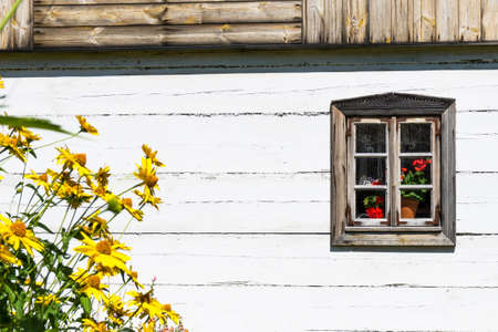 Wooden window background. Empty copy space rustic cottage house. Vintage cabin white paint wall. Countryside architecture texture.の写真素材