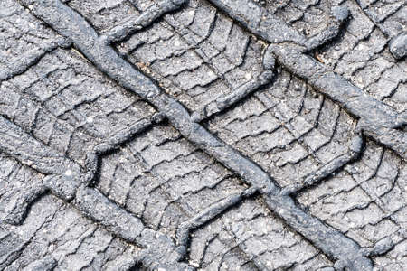 Melt asphalt imprint. Tire mark texture. Tire track on the road background. Highway street damaged...