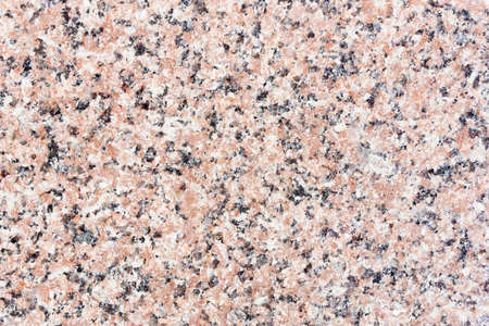 Red mineral granite texture. Natural stone flat background. Grain marble pattern. Interior and exterior home decoration. Natural noise backdrop.の写真素材