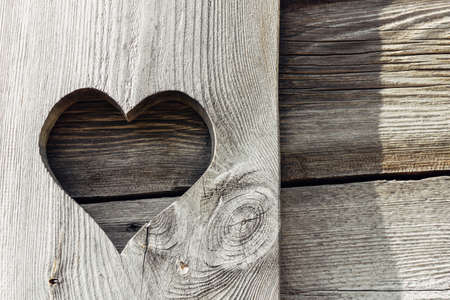 Heart shape made of wood. Rustic love symbol background. Romantic natural texture.