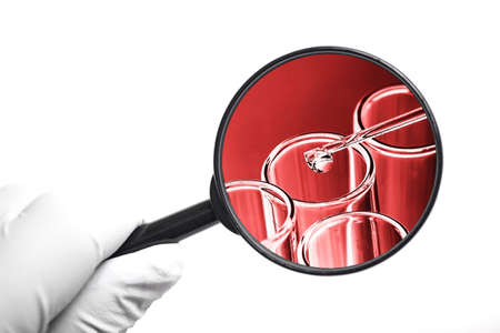 Laboratory test tube background. Covid-19 corona virus pandemic crisis. Glass pipette fluid drop....
