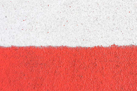 Polish flag made with paint. Concrete wall with white and red stripes. National country colors....