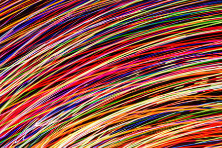 Neon lights background. Motion lines texture. Long exposure moving light pattern. Abstract night life background. Glowing lines design. Colorful chaos texture. Bright illumination background.の写真素材