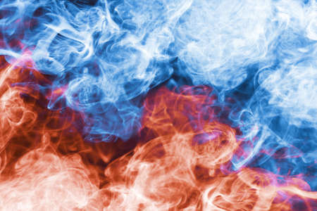 Blue and red smoke background. Air gas swirl texture. Vapor isolated on black. Chaos background. Steam shape flowing motion backdrop. Colorful flow background.の写真素材
