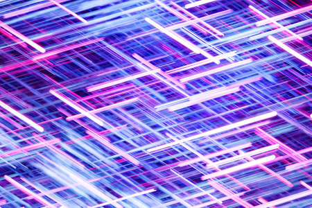 Neon lights background. Motion lines texture. Long exposure moving light pattern. Speed night life...