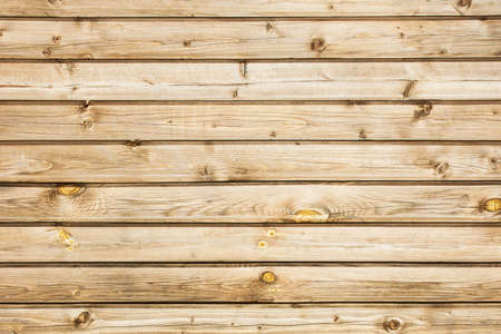 Grunge wood texture. Raw brown wooden wall background. Rustic tree desk with knots pattern. Countryside architecture wall. Village building construction.の写真素材