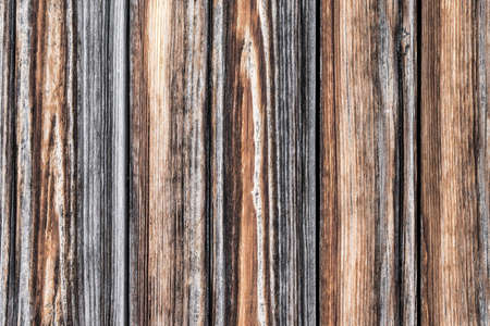 Wood texture. Raw brown wooden wall background. Rustic tree desk. Knots pattern. Countryside architecture wall. Village building construction. Old wood background.の写真素材