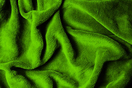Soft fabric background. Green blanket texture. Wave material pattern. Decorative curtain textile background. Wool texture. Cotton fabric pattern.の写真素材