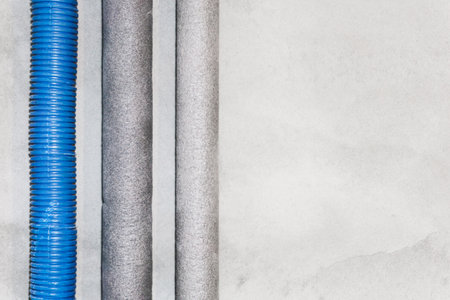 Water plumbing system background. Hot water pipes in thermal isolation. House heater installation....