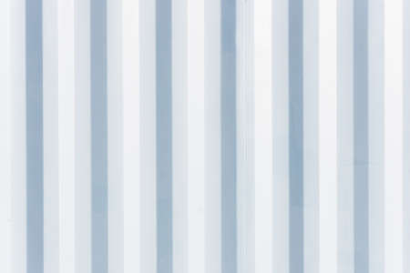 Corrugated metal texture. Metal sheet background. Tinware lines pattern. Grunge wall siding background. Striped industry construction.の写真素材
