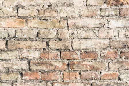 Brick wall background. Urban rustic texture. Antique house exterior wall. Vintage abandoned building architecture. Red brick construction.の写真素材
