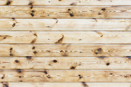 Grunge wood texture. Raw brown wooden wall background. Rustic tree desk with knots pattern. Countryside architecture wall. Village building construction.の写真素材