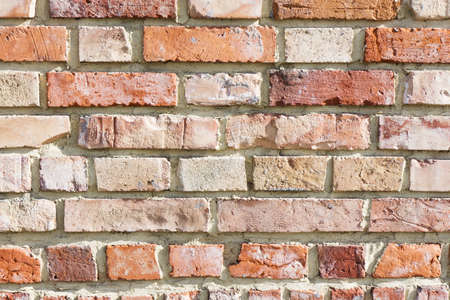 Brick wall background. Urban rustic texture. Antique house exterior wall. Vintage abandoned building...