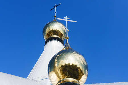 Eastern Orthodox church. Golden dome monastery. Roof domes architecture background. Christian religion cathedral. Blue sky background. Bialystok city in Poland. Empty copy space religious background.の写真素材