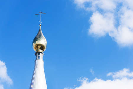 Eastern Orthodox church. Golden dome monastery. Roof domes architecture background. Christian religion cathedral. Blue sky background. Bialystok city in Poland. Empty copy space religious background.の写真素材