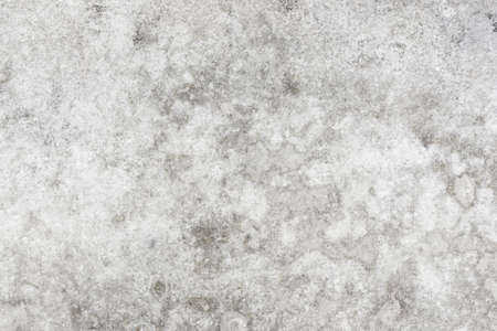 Stained concrete background. Water stains grunge wall. Gray cement texture. Grunge outdoor ground pavement pattern. Dirty cement block outside structure.の写真素材
