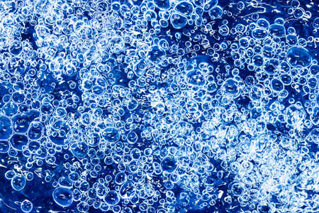 Bubbles in blue water as a background. Abstract background.の写真素材