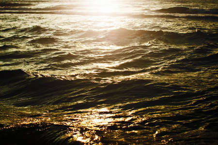 Sunset on the sea. The sun is reflected in the water.の写真素材