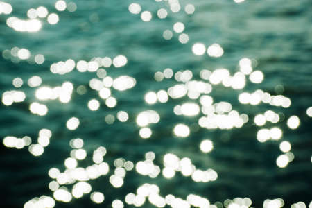 Bokeh of sea water with sun light. Abstract background.の写真素材