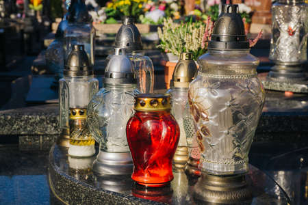 Kerosene lamp on the grave of an unknown person in the cemetery