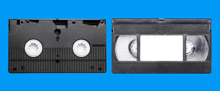 VHS video cassette isolated on blue background with clipping path. Top view.