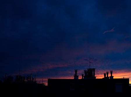 the very colorful blue sky over the cityの写真素材