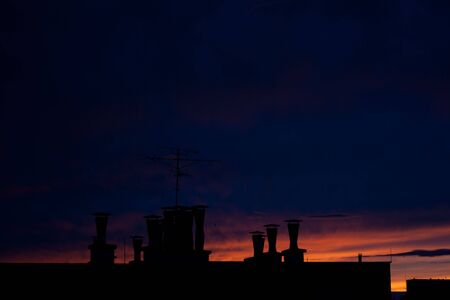 the very colorful blue sky over the cityの写真素材