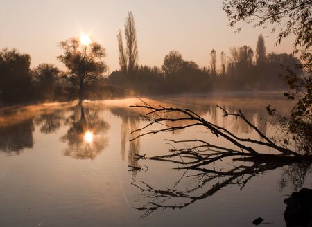 the fog over the river in early morningの写真素材