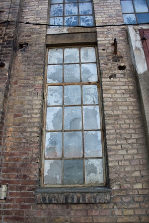 the very old window on the brick wallの写真素材
