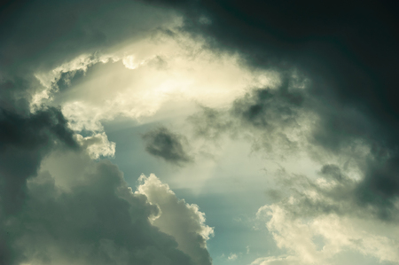 the rays of the sun shining through the cloudsの写真素材