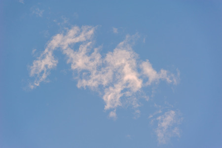 delicate and airy cloud on a background of blue skyの写真素材
