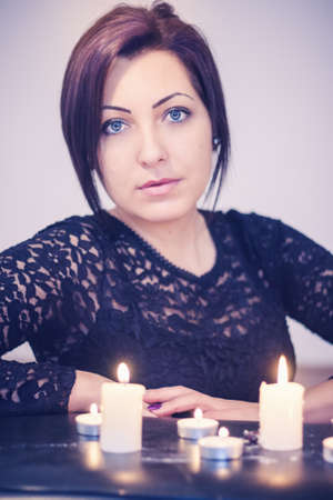 Woman portrait with candleの写真素材