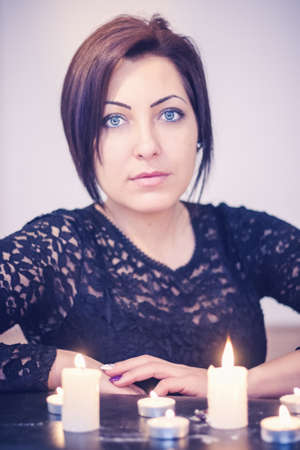 Woman portrait with candlesの写真素材