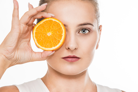 Woman beauty portrait with citrus fruitの写真素材