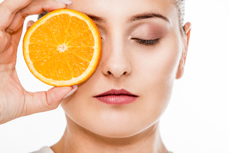 Woman beauty portrait with citrus fruitの写真素材