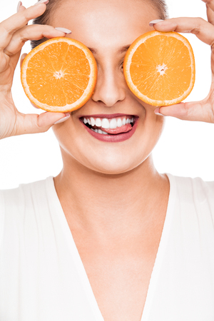 Woman beauty portrait with citrus fruitの写真素材