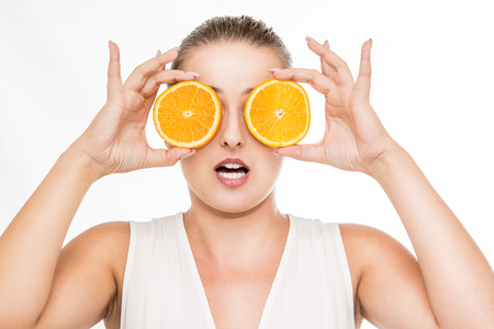 Woman beauty portrait with citrus fruitの写真素材