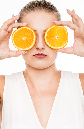 Woman beauty portrait with citrus fruitの写真素材
