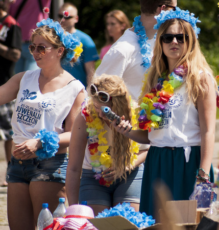 Szczecin, Poland - Mai 23, 2014  Attractive college girl shooting soap bubbles from toy gun のeditorial素材