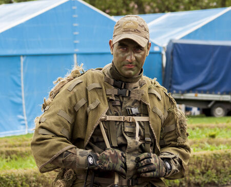 SZCZECIN, POLAND - MAY 29, 2014  Veterans Day in Poland Soldier with camouflage posing for photos 