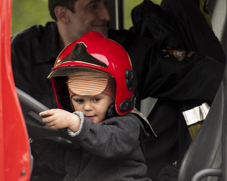 SZCZECIN, POLAND - MAY 29, 2014  Veterans Day in Poland  Child in a firemanのeditorial素材