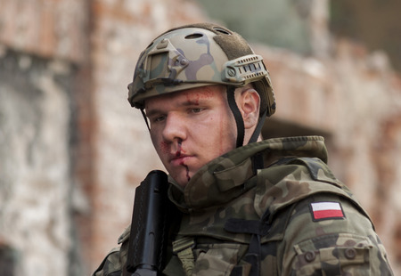 SZCZECIN, POLAND - MAY 31, 2014: Wounded Soldier in Polish Army uniform during  Historical reenactmentのeditorial素材